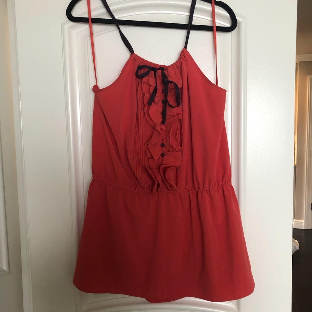 Ya coral blouse with purple accent.